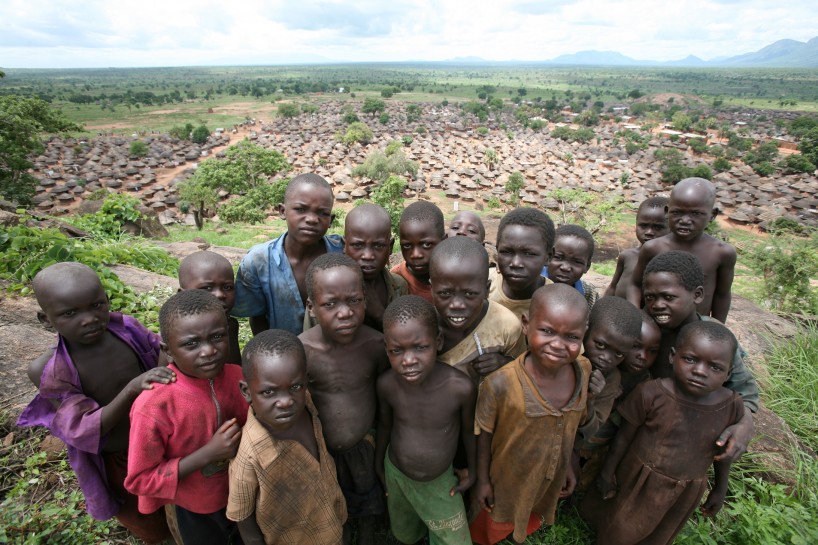 Children pose for a photo on a hill overlooking Omiya- Anyima IDP camp in Kitgum District, northern Uganda. Photo: Manoocher Deghati/IRIN