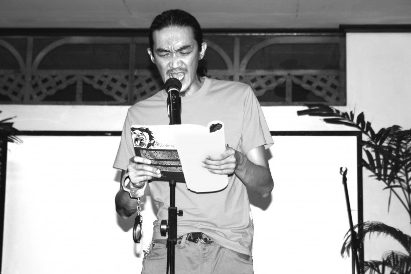 Axel Pinpin, poet, activist and agriculturist, reading from Tungmaang Matatabil, a collection of poems written over the 2-year period he was imprisoned. 