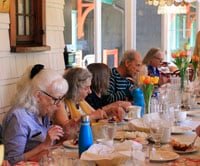 Group of people sharing a meal at a large table