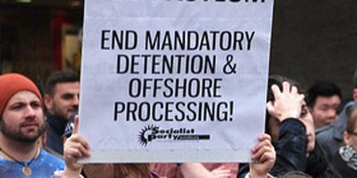 Sign at protest - "End mandatory detention"